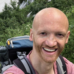 Markus Kappen with backpack on his back hiking.