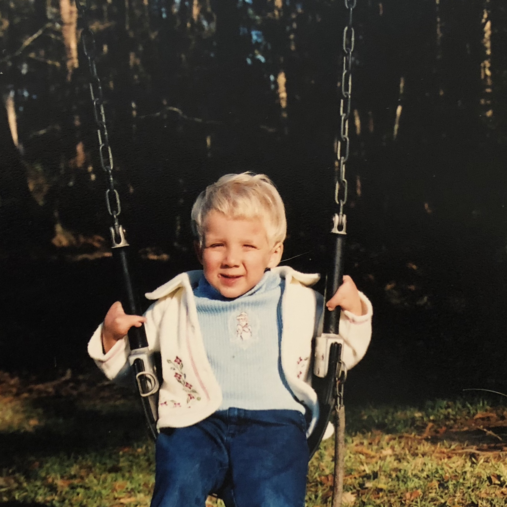 Greta as a small child swinging