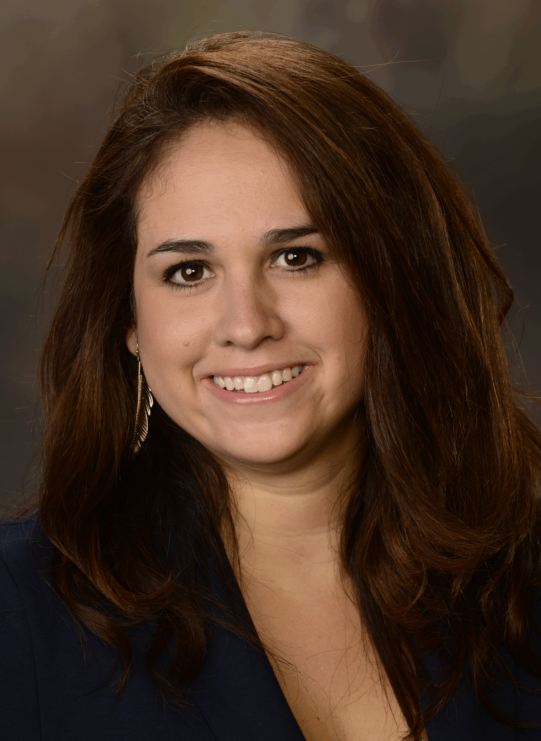 This is a headshot of Morgan who has dark hair and dark eyes.