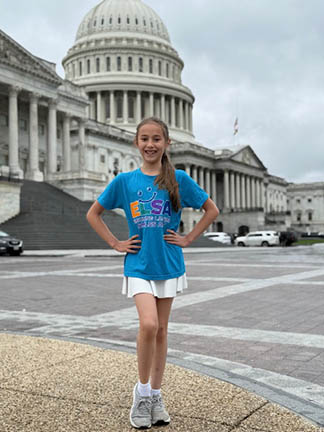 Keira poses by the capitol building.