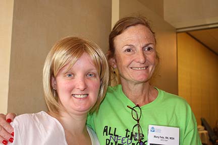 Mary has her arm around a young woman affected by ectodermal dysplasia.