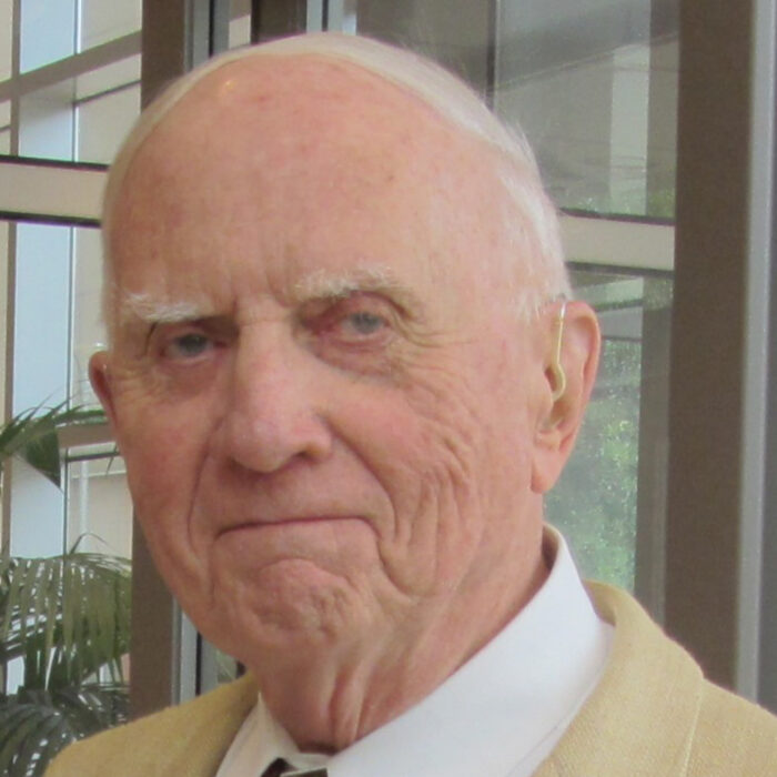 Headshot of Dr. Robert Goltz who is an older man wearing a shirt, jacket and tie.