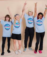 Four women affected by EEC syndrome have their arms up in the air.