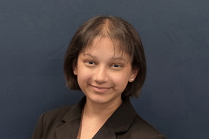 Head shot of Emily who is wearing a black jacket. She's a teenager.